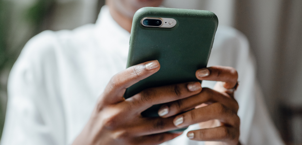 A closeup shot of a person holding a smartphone.