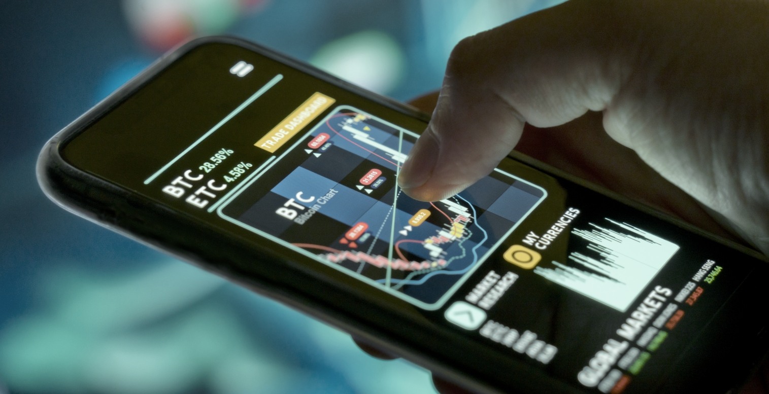 Person views a cryptocurrency market summary on their smartphone