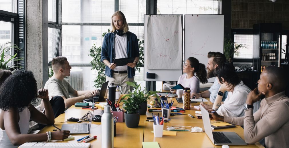 Managers at a company meet to discuss payroll providers
