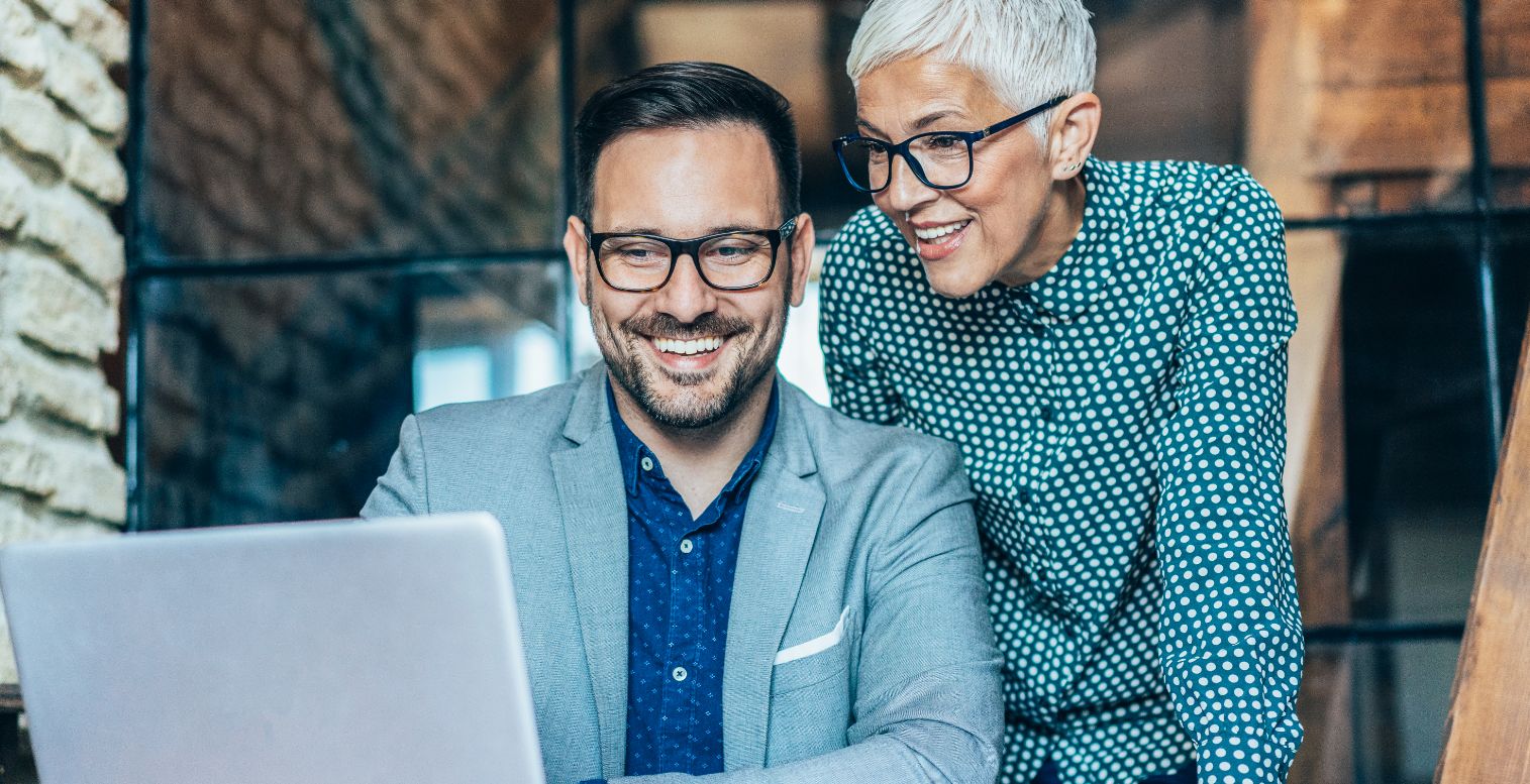 Two business partners look at pay-fac options