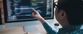 Development Languages man looking at computer screen