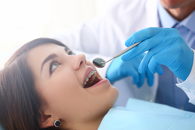 women having teeth inspected at the dentist office