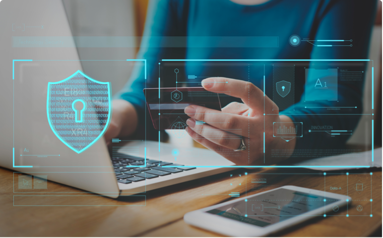 women holding her credit card while looking at her laptop screen