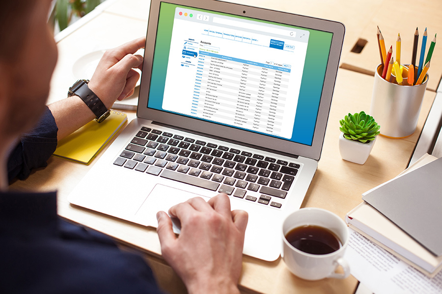 man working on his laptop looking at OpenEdge view portal