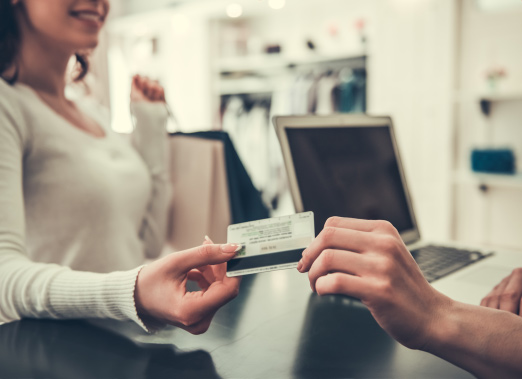 Woman making a payment to a merchant.
